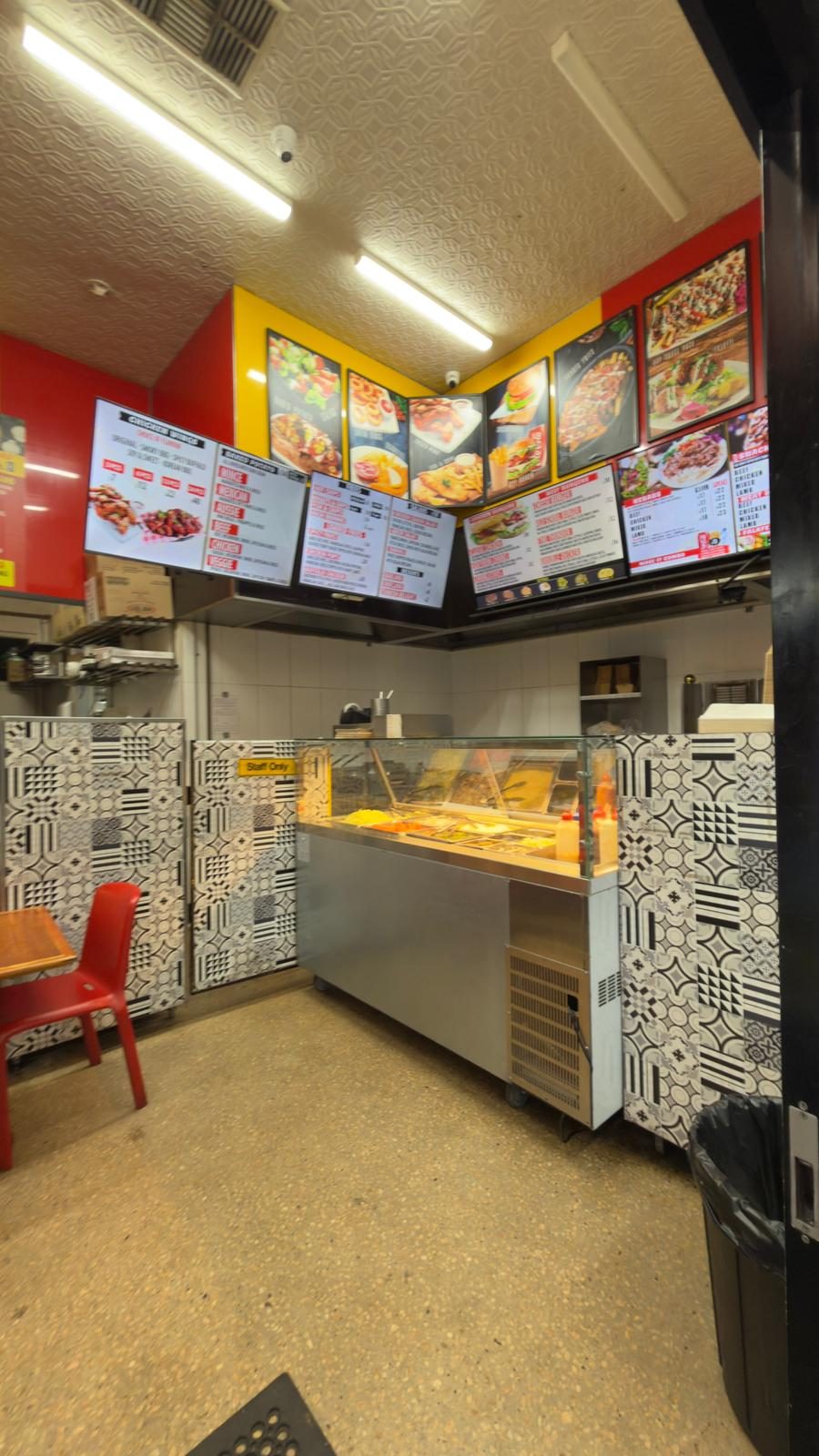 Inside the shop — counter and menu boards